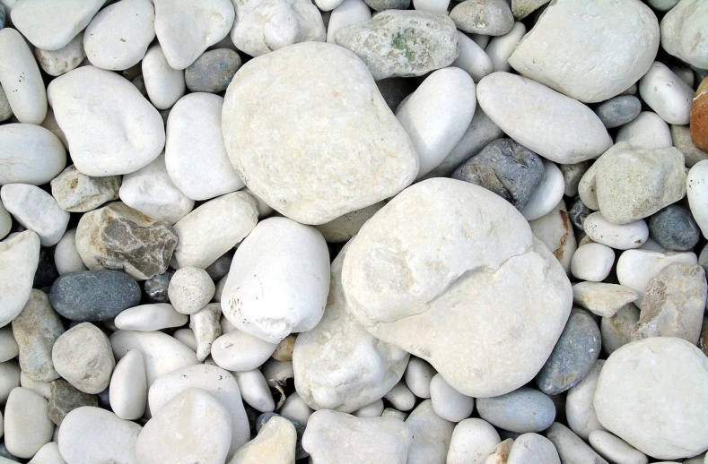 a pile of rocks sitting on top of a pile of gravel, a picture, flickr, greek white marble, grain”