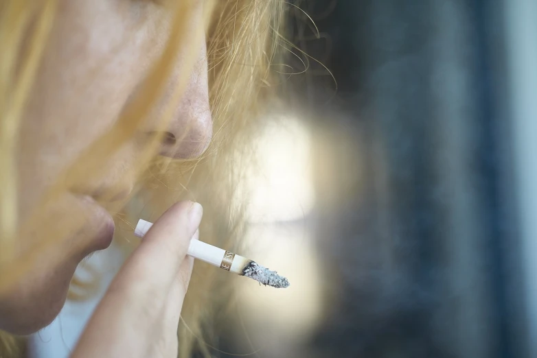 a close up of a person smoking a cigarette, a picture, happening, close up of a blonde woman, behaelterverfolgung, deep detailed