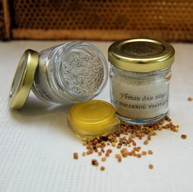 a close up of a jar of food on a table, a picture, by Maksimilijan Vanka, dau-al-set, stone dust, mustard, silver small small small glasses, highly detailed product photo