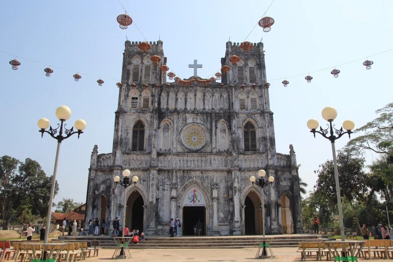 a church with a clock on the front of it, baroque, in style of lam manh, cathedrals and abbeys, cathedrals, in a large cathedral