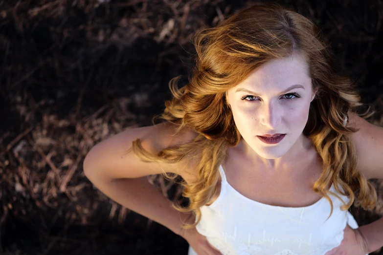 a woman with a surprised look on her face, a portrait, by Matt Cavotta, flickr, long curl red hair, a beautiful woman in white, top down shot, harsh sunlight