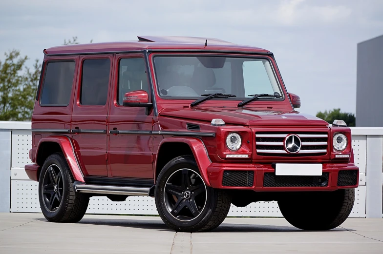 a red mercedes benz benz benz benz benz benz benz benz benz benz benz benz benz benz benz, by Alexander Fedosav, pixabay, land rover defender, wine red trim, 3 / 4 extra - wide shot, best on adobe stock