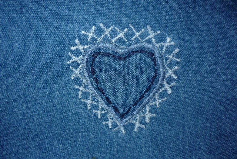 a heart drawn on the back of a pair of jeans, by Magdalene Bärens, pexels, folk art, fabric embroidery, detailed shading, y2k design, embroidered shirt