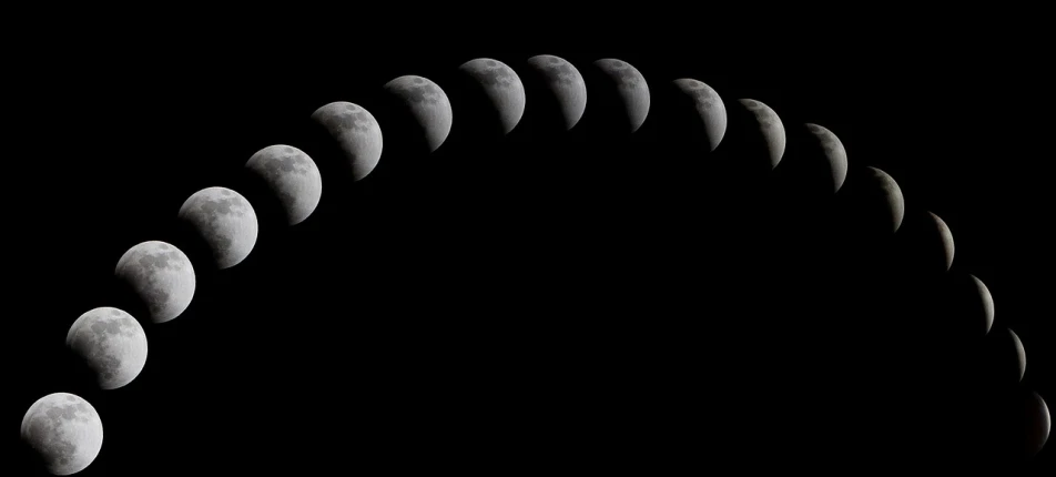 a black and white photo of phases of the moon, a photo, by Yasushi Sugiyama, pixabay, red lunar eclipse, in a row, dividing it into nine quarters, moonbow