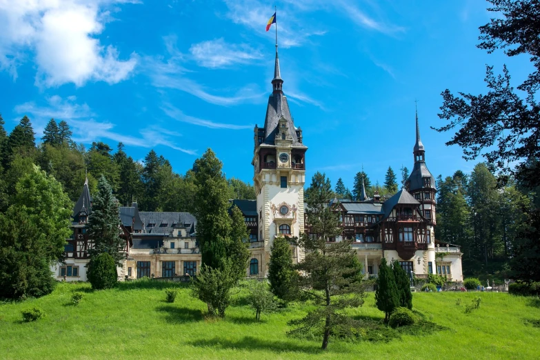 a castle sitting on top of a lush green hillside, a photo, by Bertalan Székely, shutterstock, art nouveau, wooden, hotel, inside a grand, highly detailed photo