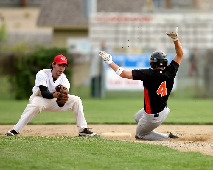 a baseball player sliding into a base during a game, by Dave Allsop, shutterstock, black and orange, sumerville game, split in half, 6 4 0