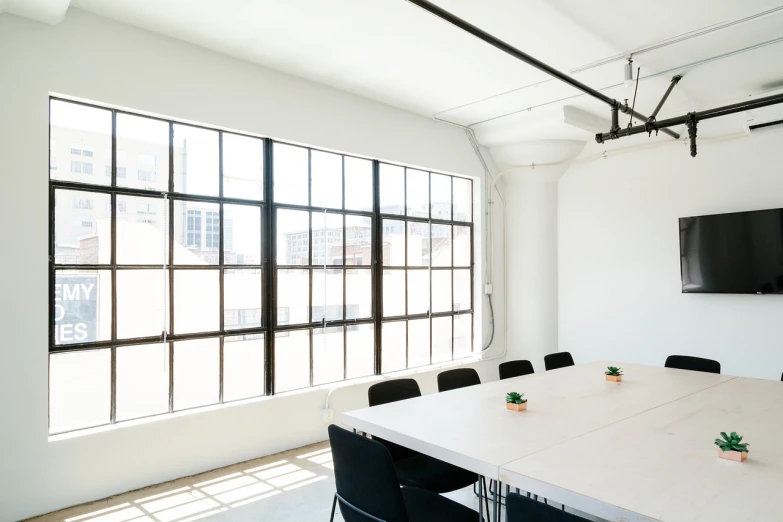 a conference room with large windows and a flat screen tv, unsplash, light and space, white and black color palette, industrial aesthetic, los angeles, basic white background
