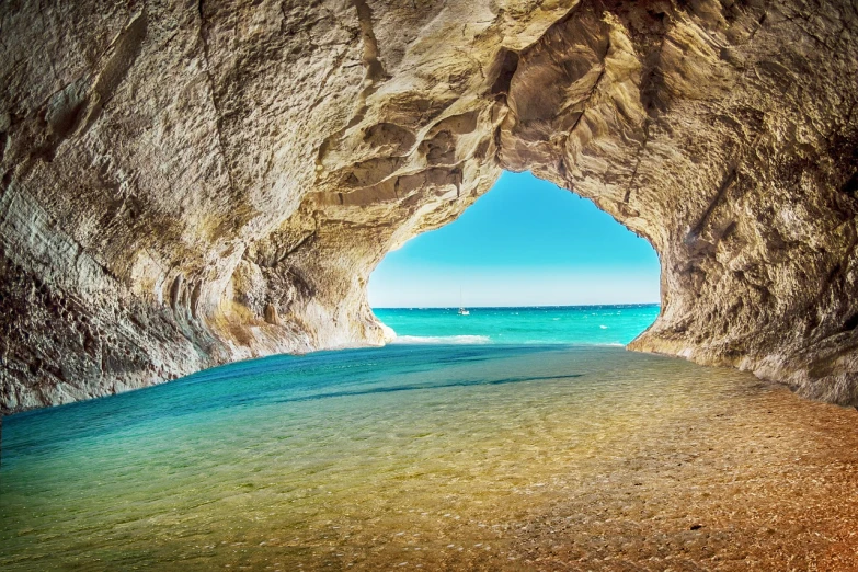 a view of the ocean from inside a cave, shutterstock, beautiful italian beach scene, michigan, bright vivid colors, river with stunning water