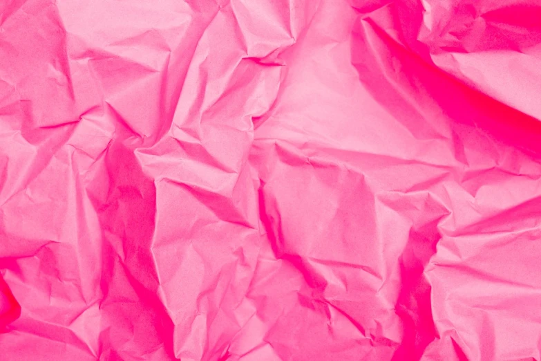 a cat laying on top of a sheet of pink paper, a stock photo, by Richard Carline, pexels, fine art, paper crumpled texture, flowing neon-colored silk, high detailed close up of, wrapped