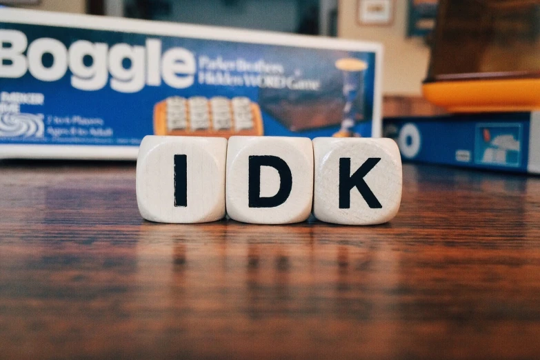 a couple of dices sitting on top of a wooden table, by Dicky Doyle, flickr, letterism, tiktok 4 k uhd image, ike in real life, kodak photo, proud look
