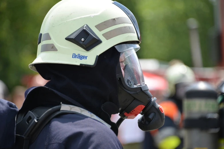 a close up of a person wearing a helmet, by Robert Zünd, shutterstock, figuration libre, firefighter, detailed zoom photo, spec - ops head with mask, very detailed photo