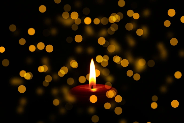 a candle that is lit in the dark, a picture, bokeh. brian spilner, shining gold and black and red, under the silent night sky, avatar image