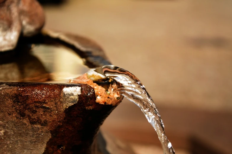 a close up of a fountain with water coming out of it, a macro photograph, renaissance, japanese pottery, set photo, drinking, high details photo