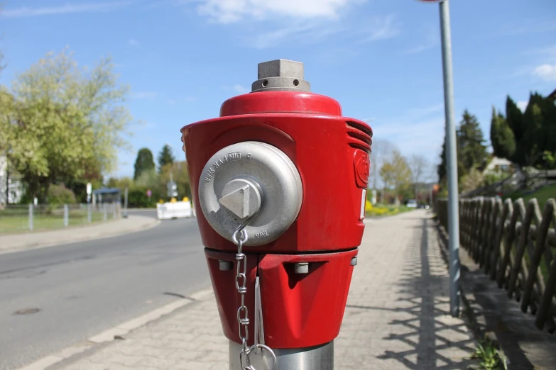 a red fire hydrant sitting on the side of a road, a stock photo, by Thomas Häfner, modular item, shiny silver, well designed head, assembled