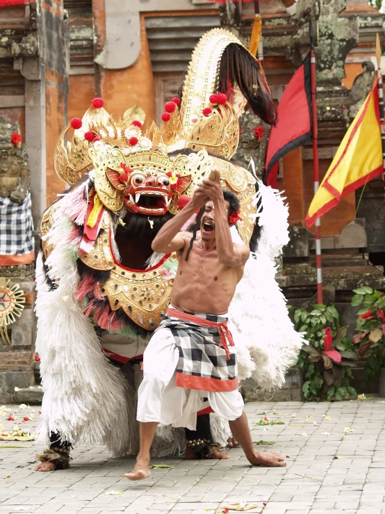 a man that is standing in front of a dragon, inspired by I Ketut Soki, happening, he is dancing, the spirit of the bull run, closeup shot, lion