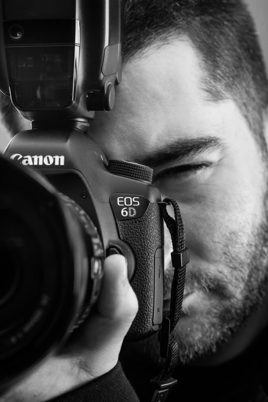 a man taking a picture with a camera, a black and white photo, inspired by Camilo Egas, close-up!!!!!, canon eos 6d, cover shot, 1 / 4 headshot