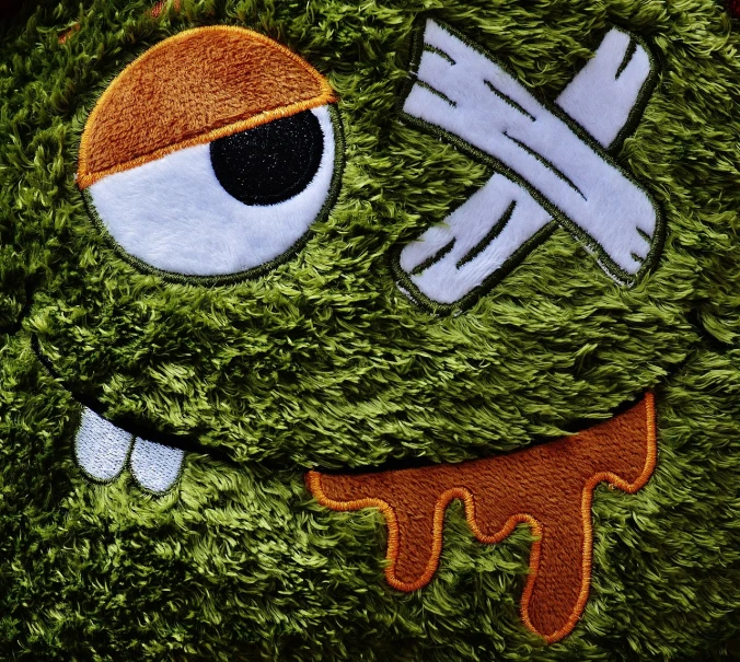 a close up of a stuffed animal wearing a pirate hat, a macro photograph, by Murakami, graffiti, cute monster character design, swampy, 8k fabric texture details, grassy