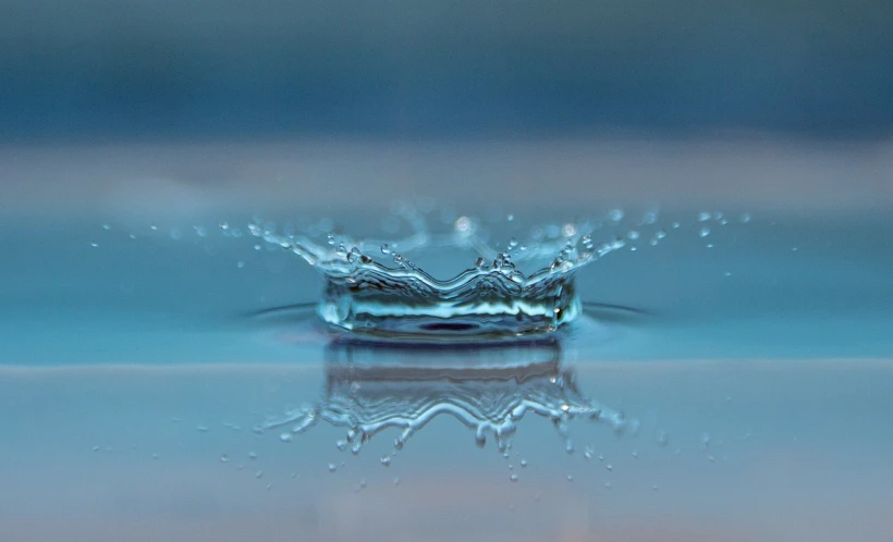 a close up of a splash of water on a surface, a macro photograph, by Jan Rustem, unsplash, floating crown, avatar image, round-cropped, hyperdetailed photo