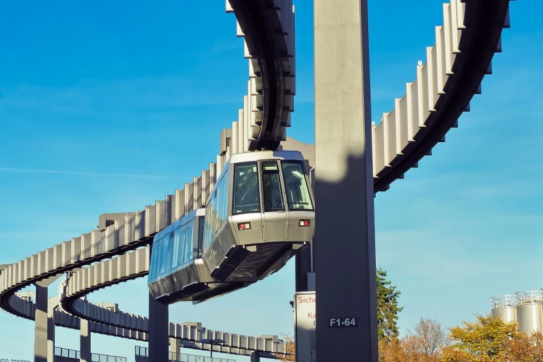 a close up of a train on a track, by Alexander Fedosav, flickr, bauhaus, monorail station, washington dc, facebook post, bjarke ingels