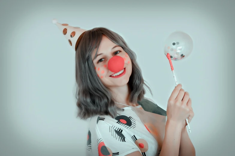 a woman with a clown nose holding a toothbrush, a colorized photo, by Emma Andijewska, cosplayer, baloons, animation character, wearing a party hat