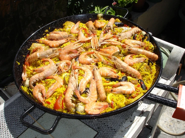 a large pan filled with shrimp and rice, by Matteo Pérez, pixabay, dada, al fresco, marker”, costa blanca, award-winning”