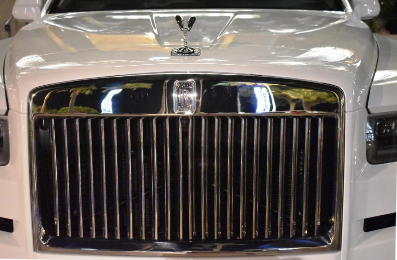 the front of a white rolls royce car, by David Burton-Richardson, mechanical detail, chrome plated, grid, 2000