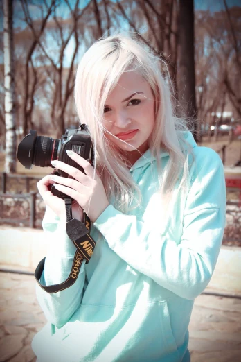 a woman taking a picture with a camera, a picture, inspired by Elsa Bleda, tumblr, art photography, white - blond hair, ukrainian girl, canon 5d mark iii photo, pretty girl with blue hair