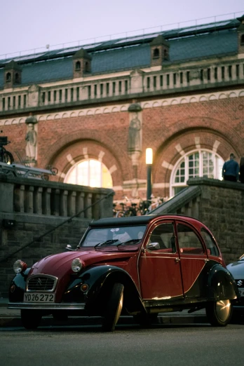 a couple of cars that are parked in front of a building, by Jörg Immendorff, renaissance, biopic, summer evening, museum photoshot, 35mm of a very cute