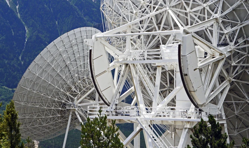 a group of satellite dishes sitting next to each other, by Kurt Roesch, pixabay, detail structure, “ aerial view of a mountain, big telescope in front, white mechanical details