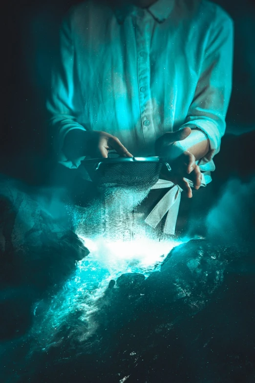 a person holding a piece of paper in their hands, by Cyril Rolando, pexels contest winner, magical realism, smelting pit'beeple, cyan mist, closeup fantasy with water magic, high quality fantasy stock photo