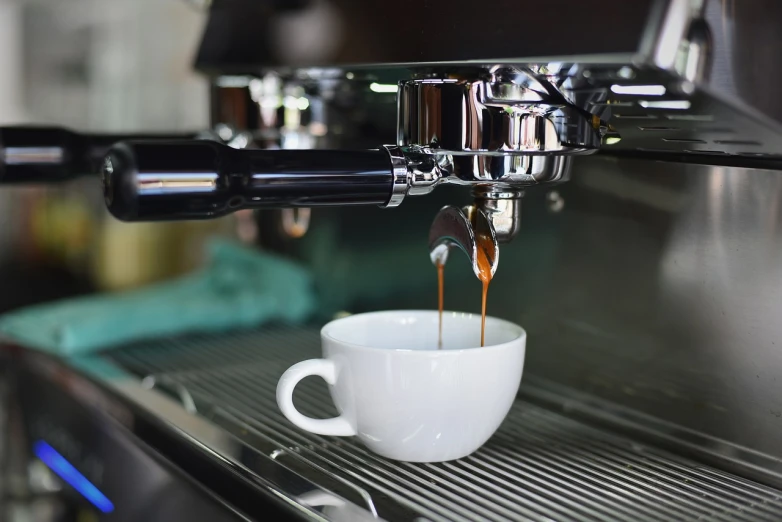 a cup of coffee being poured into a coffee machine, shutterstock, process art, closeup photo, glazed, stock photo