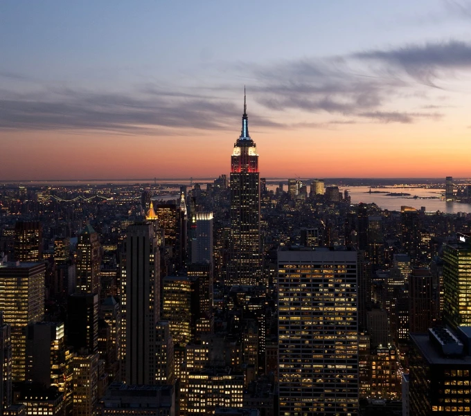 a view of a city from the top of a building, by Robert Jacobsen, happening, beautiful and spectacular dusk, new york backdrop, spire, ap news photo