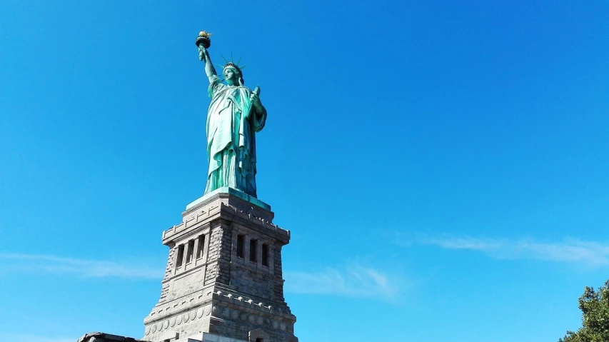 a statue of liberty on a sunny day, shot on gopro9, sidney lugo, elegant shot, small stature