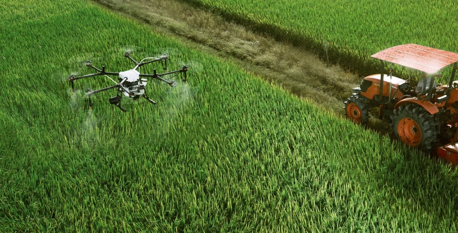 a tractor that is sitting in the grass, a digital rendering, pixabay, renaissance, helicopter drones, malaysia with a paddy field, drone photograpghy, green gas spreading across land