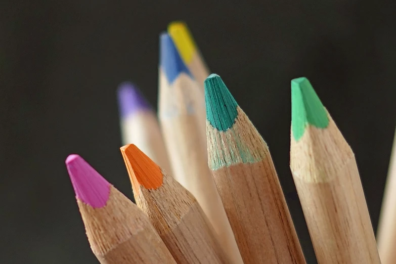 a close up of a bunch of colored pencils, a picture, by Harold von Schmidt, pexels, today\'s featured photograph 4k, subtle colors, macro photo, two colors