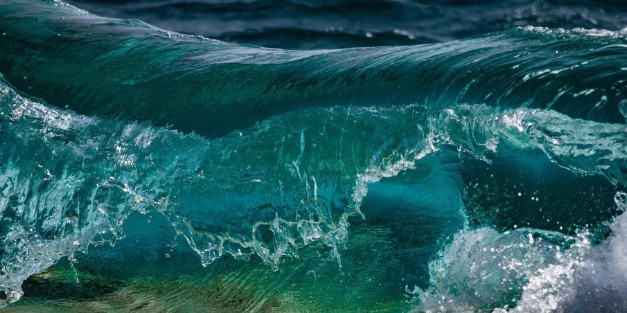 a man riding a wave on top of a surfboard, a picture, by Richard Carline, shutterstock, fine art, glass refraction, flowing teal-colored silk, seafloor, texture