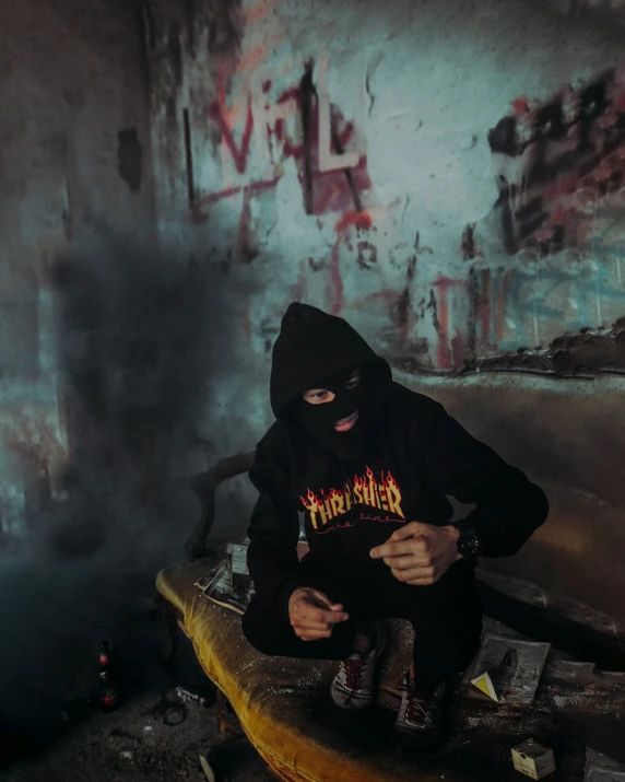 a man in a black hoodie sitting on a surfboard, a portrait, tumblr, graffiti, tactical team in hell, 🕹️ 😎 🔫 🤖 🚬, fiery atmosphere, hasselblade shot