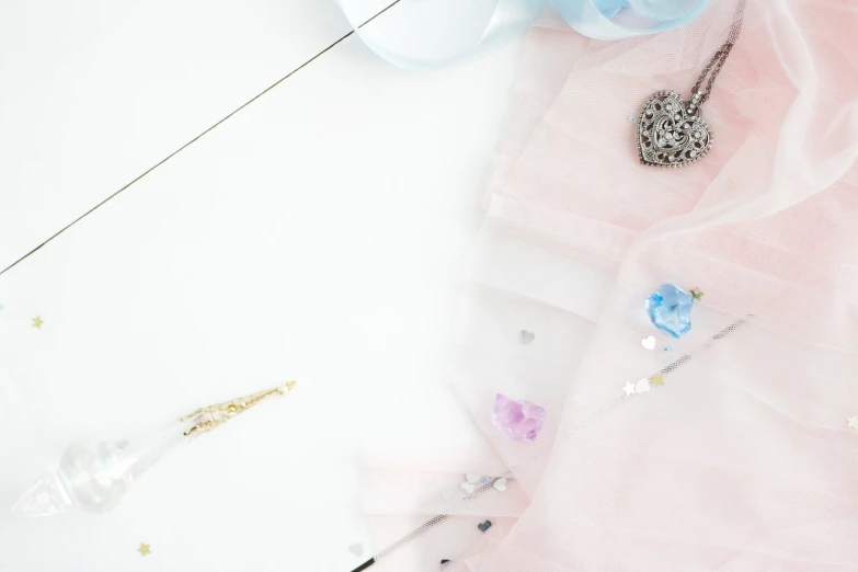 a pair of scissors sitting on top of a table, inspired by Sailor Moon, aestheticism, tulle and lace, professional product photo, background is white, various items