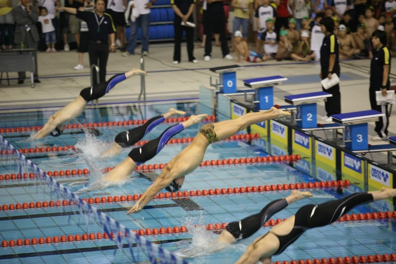 a group of people swimming in a pool, synchromism, in a race competition, ivan laliashvili, victory lap, full - length photo