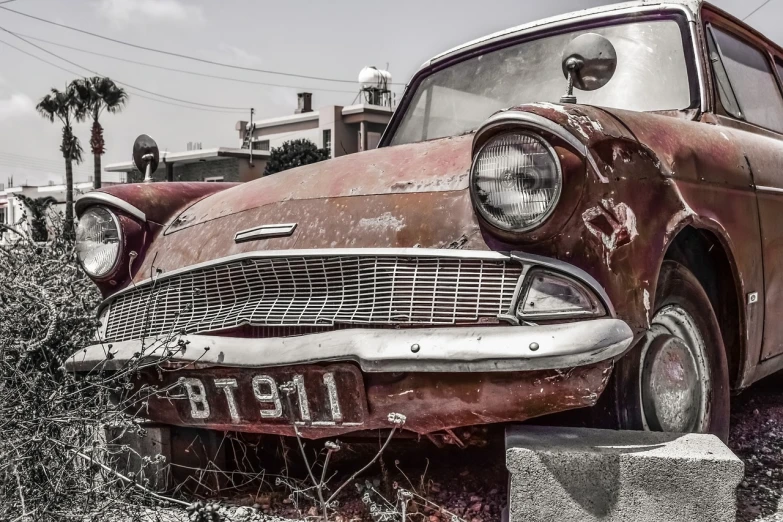 an old car parked on the side of the road, by Matthias Weischer, pexels contest winner, photorealism, dull red flaking paint, eyes!, colorised, close-up!!!!!!