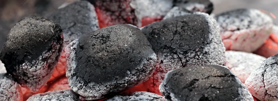 a pile of coal sitting on top of a fire, red and black colour scheme, 💣 💥, barbecuing chewing gum, background image