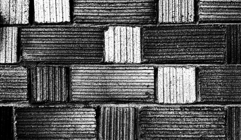 a black and white photo of a brick wall, a stipple, inspired by Pierre Soulages, concrete art, phone wallpaper, squares, stacked, paved