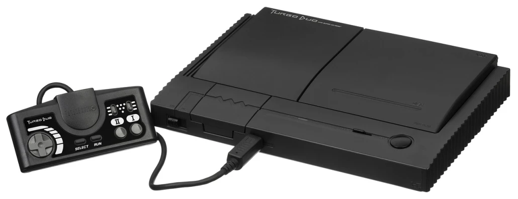 a video game system sitting on top of a table, a stock photo, inspired by Jan Kupecký, neogeo, charging plug in the chest, turbo, packshot, black main color