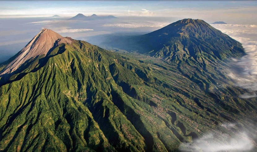 a couple of mountains that are in the air, a picture, flickr, sumatraism, volcano valley, aerial view of an ancient land, arsitektur nusantara, impeccable military composure