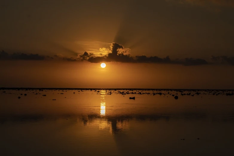 the sun is setting over a body of water, a picture, by Juergen von Huendeberg, aruba, museum quality photo, lagoon, india