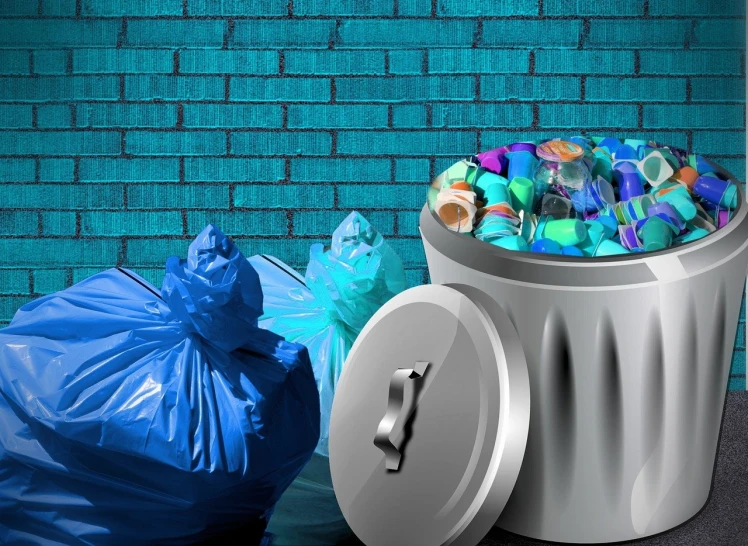 a trash can sitting next to a blue trash bag, a digital rendering, shutterstock, plasticien, brick debris, background image, multi - coloured, plastic wrap