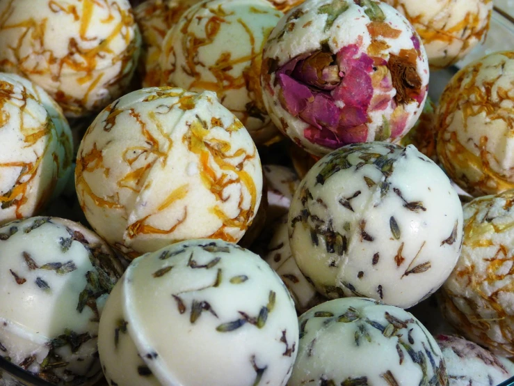 a close up of a plate of cake balls, by Lee Loughridge, process art, dried herbs, intricate beautiful close up, soap, ladies