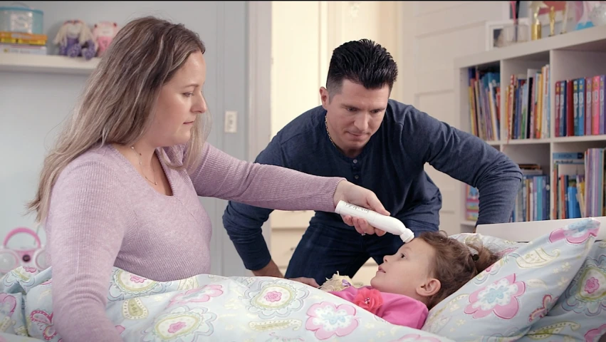 a man and a woman brushing a child's teeth, commercial, alexa grace, prosthetic arm, blanket