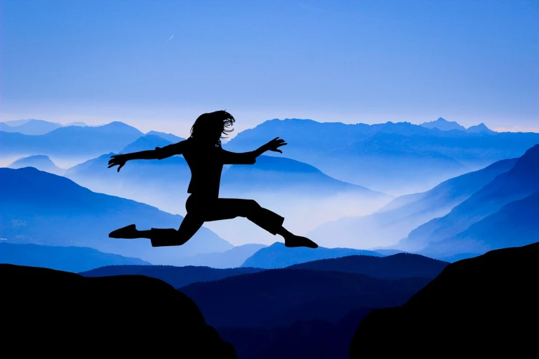 a person jumping in the air with mountains in the background, figuration libre, woman silhouette, blue, prize winning, self-confidence