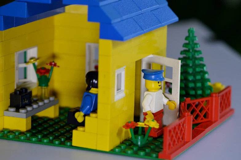 a lego house sitting on top of a table, flickr, opening scene, cottage close up, blue and yellow theme, screen cap